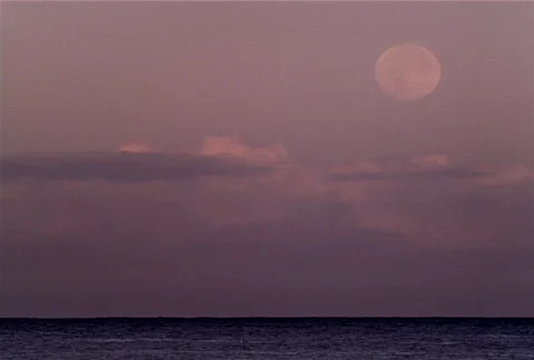 Full Moon Rises over Ocean NTSC Stock Footage