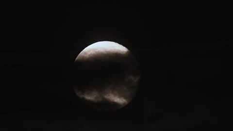 Full moon rises through haunting clouds in stunning 4k time lapse under the Stock Footage 305430351