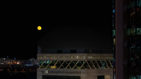 Full moon rising in Dubai Stock Footage 230847904