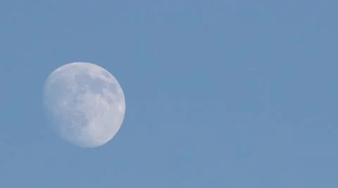 Full Moon rising during daytime Stock Footage