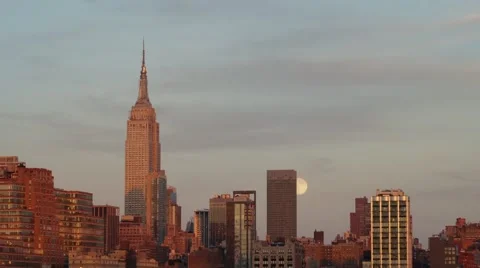 Full Moon rising next to the Empire State Building​ at Sunset Time-Lapse Stock Footage 68053763