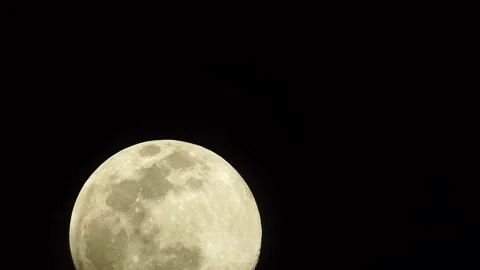 Full moon rising at night Stock Footage 135370703