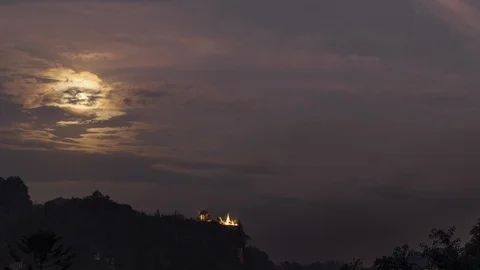 Full moon rising over a Buddhist temple on a hill, 4K time lapse / timelapse Video stock 108400887