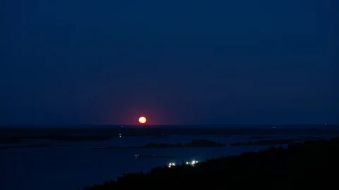 Full moon rising over night river valley Stock Footage 112791486