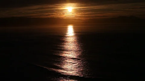 Full moon rising over the ocean Stock Footage 87654177