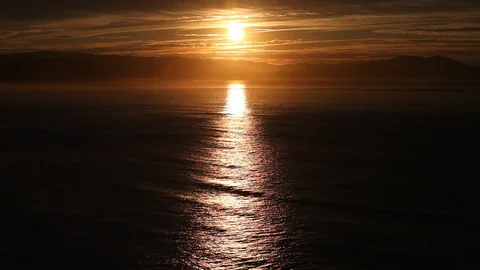 Full moon rising over the ocean Stock Footage 90489916