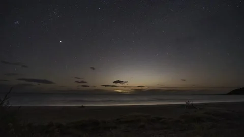Full moon rising over the ocean on a marvelous beach in New Zealand, 4k Stock Footage 231931016