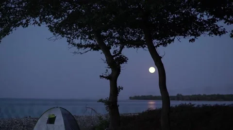 Full Moon Rising Over Tent Handheld 4K Video stock 67397228