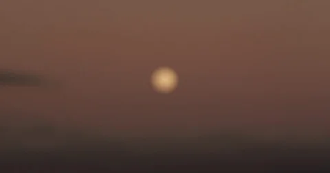 Full Moon Rising In Sunset Sky Stock Footage 79735995