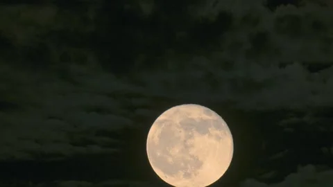 Full moon rising through clouds in New Taipei City Stock Footage 344694644