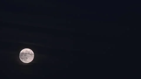 Full Moon Rising Through Thin Clouds at Night – 4K Timelapse Footage Stock Footage 320575177