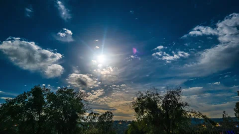 Full Moon Sets Through Clouds into Pale Blue Dawn Stock Footage 282548914