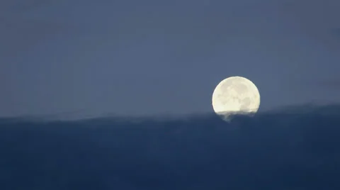 Full Moon Setting into the Clouds at Night Stockbeeldmateriaal 34574505