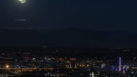 Full Moon Setting Over the Rocky Mountains, Denver, CO Stock Footage 89556538