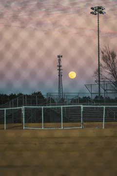 Full moon setting Stock Photos