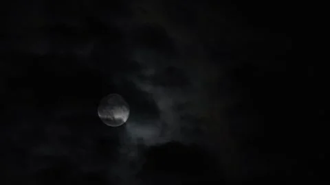Full moon shining brightly through dark night clouds Stock Footage 320291835