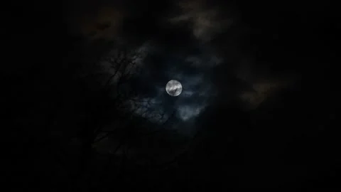 Full moon shining through clouds at night Stock Footage 152818584