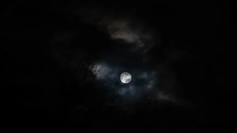 Full moon shining through clouds at night Stock Footage 152819039