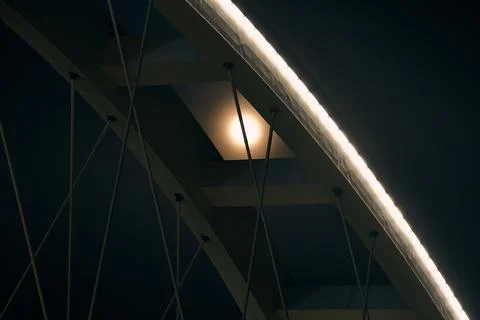 Full moon shining through modern bridge architecture at night, minimalist urban  Stockfoto's