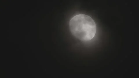 Full Moon Shining Through Moving Clouds in the Night Sky with Atmospheric Haze Video stock 339166485
