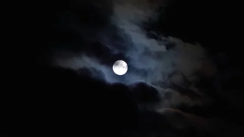 Full moon in the sky with clouds at night. Full moon on a dark cloudy night. Stock Footage 249431696