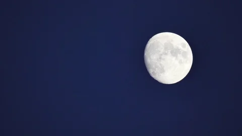 The full moon in sky moves across the horizon. Close-up moon, craters of moon Stock Footage 122287975