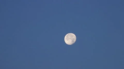 The full moon in sky moves across the horizon. Close-up moon, craters of moon Stock Footage 140840901