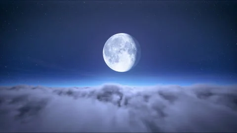 Full moon on starry sky above moving clouds Stock Footage 244389811