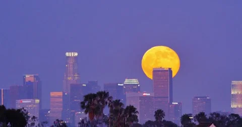Full moon supermoon rising above downtown Los Angeles skyline, night city. 4K Stock Footage 40250277