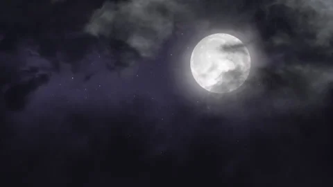 Full Moon Surrounded By Clouds in the night sky. Stock Footage 277653316