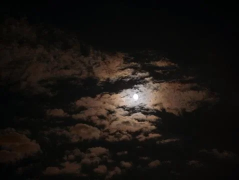 Full moon surrounded by dramatic clouds Stock Photos