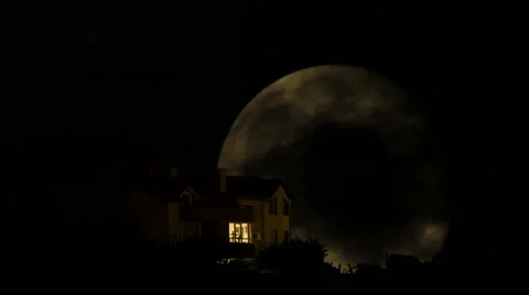 Full Moon Time Lapse behind the mystery house with moving clouds Stock Footage 42567734