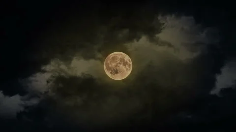 Full moon time-lapse as it eventually becomes obscured by clouds Stock Footage 68585426