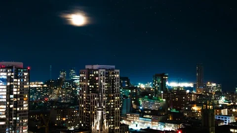 FULL MOON TIME LAPSE, PASSING CLOUDS OVER CITY LIGHTS Stock Footage 94820632