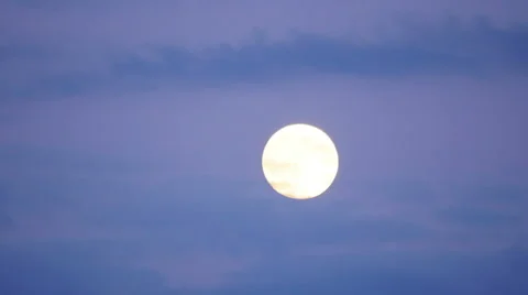 Full moon timelapse with clouds at twilight, zoom out, 4k Stock Footage 58669732