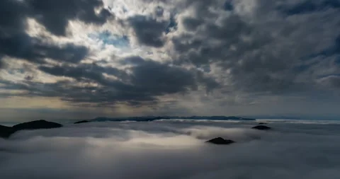 Full Moonlight Rays Through Clouds in Misty Mountains Landscape, Serene Night Stock Footage 317248745