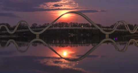 Full moonrise over a pedestrian bridge in Obolonskyi District, Kyiv, Ukraine Stock Footage 306213053