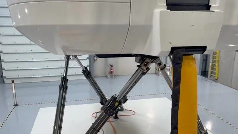 Full Motion Latest-generation Flight Simulator in Operation. Lower Part and Stock Footage 337575817