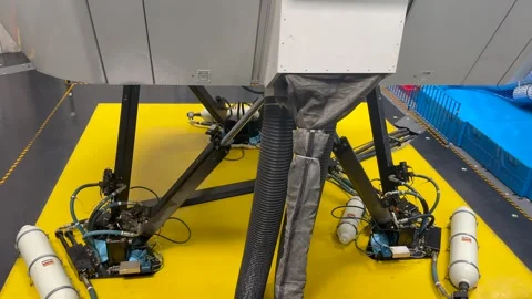 Full Motion Old Flight Simulator in Operation in a Training Session. Hydraulic Stock Footage 337574137