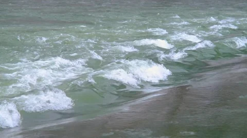Full mountain river. Raging mountain river. The water is seething on the river Stock Footage 264061991