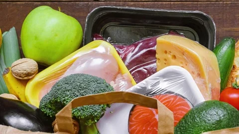 Full paper bag of different healthy balanced food from the market. Fruits Video stock 253172935