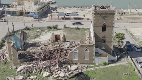 Full perimeter drone view of damaged church Stock Footage 340824642