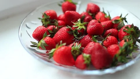 A full plate of red strawberries on the table Stock-Footage 130319845