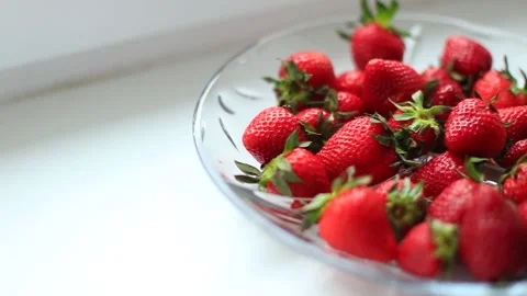 A full plate of red strawberries on the table. Stock Footage 130319862