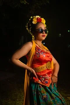 Full portrait of an elegant dancer in vivid traditional ceremonial attire Stock-Fotos