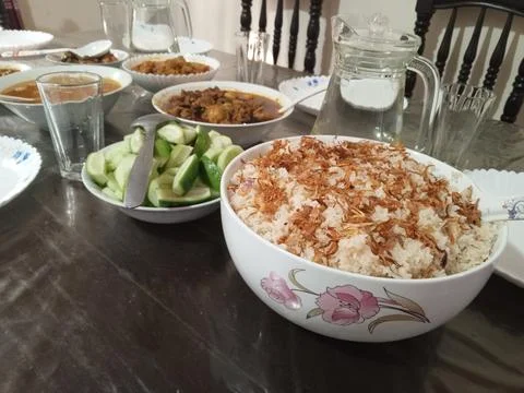 Full pot of rice is placed on the dining table for lunch. Stock Photos