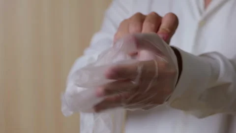 Full process of putting semi transparent gloves on both hands. 库存影片 345460902