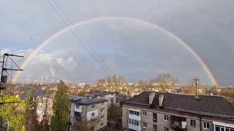 Full Rainbow Over Cityscape After Rainstorm Stock Footage 325223054