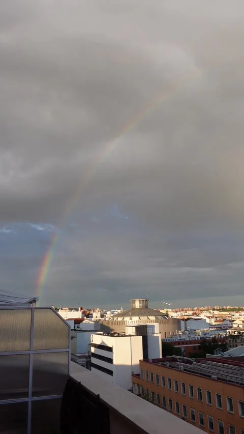 Full rainbow in the sky of Madrid Stock Footage 277933519