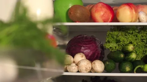 Full refrigerator of fresh healthy food. Slow mo. Stock Footage